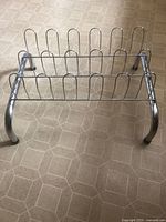 Full view of chrome metal shoe rack