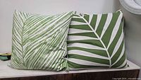 Pair of cushions showing both leaf patterns