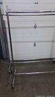 Full view of chrome rolling garment rack
