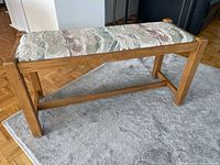 Full view of bench showing oak frame and jacquard seat