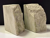 Front view of both marble bookends showing rough and polished surfaces