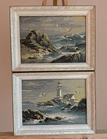 Front view of both framed seascape paintings