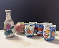 Group shot of all seven porcelain pieces