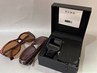Watch phone in presentation box with both pairs sunglasses