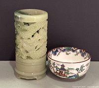 Front view showing carved jade vase and hand-painted bowl together