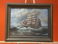 Front view of framed painting showing maritime ship scene