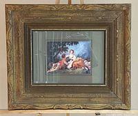 Front view of framed print showing ornate gilt frame and matted artwork