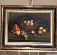 Full view of framed still life painting on easel