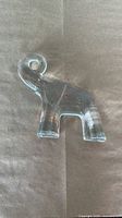 Front view of clear glass elephant figurine