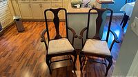 Front view of both armchairs showing overall design and condition
