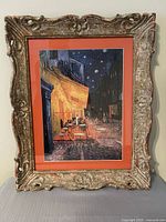 Front view of framed print with mat and ornate frame