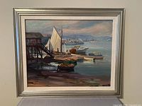 Front view of framed harbour oil painting