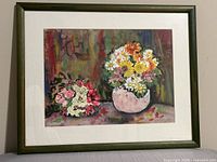 Full view of framed watercolour showing floral still life, mat and frame