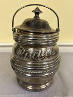 Front view showing engraved "Biscuits" text and overall form