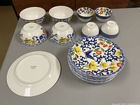 Full set of bowls and plates displayed
