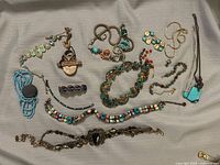 All thirteen jewellery pieces laid out for overview