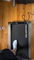 Top view of treadmill in use showing Walker Pro branding on belt