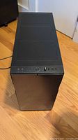 Top view of black Fractal Design Define R5 tower showing power button and front I/O