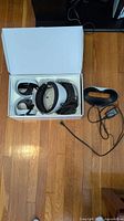 Open box showing VR2 headset, two controllers, cables neatly packed