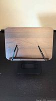 Front view of walnut-finish book holder on stand
