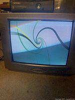 Front view of Magnasonic CRT TV displaying colour spiral pattern