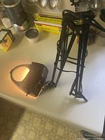 Lamp folded with arm and lighted head