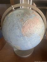 Full view of globe on stand showing Atlantic Ocean and surrounding continents