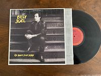 Front album jacket with vinyl and inner sleeve visible