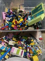 Top view of bin showing large quantity of assorted LEGO pieces