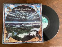 Front cover and vinyl record visible