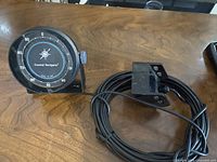 Front view of depth sounder gauge showing dial and markings