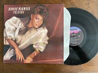 Front album cover and record partially removed