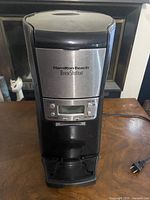 Front view showing brand panel, controls and dispensing platform