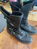 Full view of both boots from above showing leather, straps, zippers