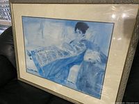 Front view showing framed Lady in Blue print with mat and frame