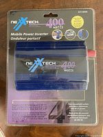 Front of sealed package showing Nexxtech 400 W mobile power inverter