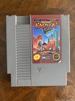 Front view of Karnov NES cartridge with intact label