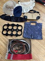 All items laid out showing hats, belts, handbags, organizer