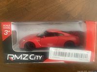 Front view of RMZ City boxed red model car