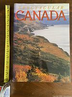 Front cover showing title, author and measuring tape for scale