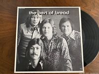 Front cover of The Best of Bread LP partially showing vinyl disc