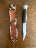 Knife and sheath laid flat, full view