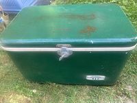 Full view of green Thermos metal cooler closed