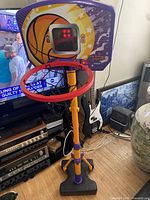 Full view of VTech Hoop Madness electronic basketball hoop on stand