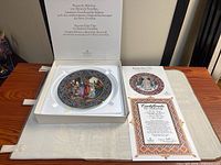 Plate in open presentation box with COA displayed