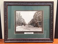 Full view of framed photograph with mat and frame