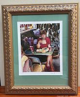 Full view of framed art print with frame and mat visible