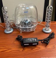 Full system: subwoofer, two satellites, power adapter