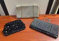 All three evening clutch bags front view with chains displayed