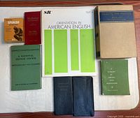 All eight books laid out on table